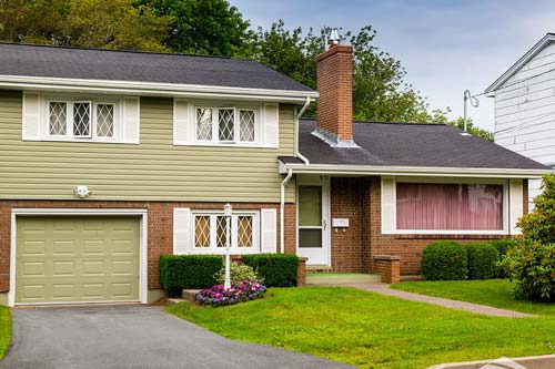 Green siding on home.